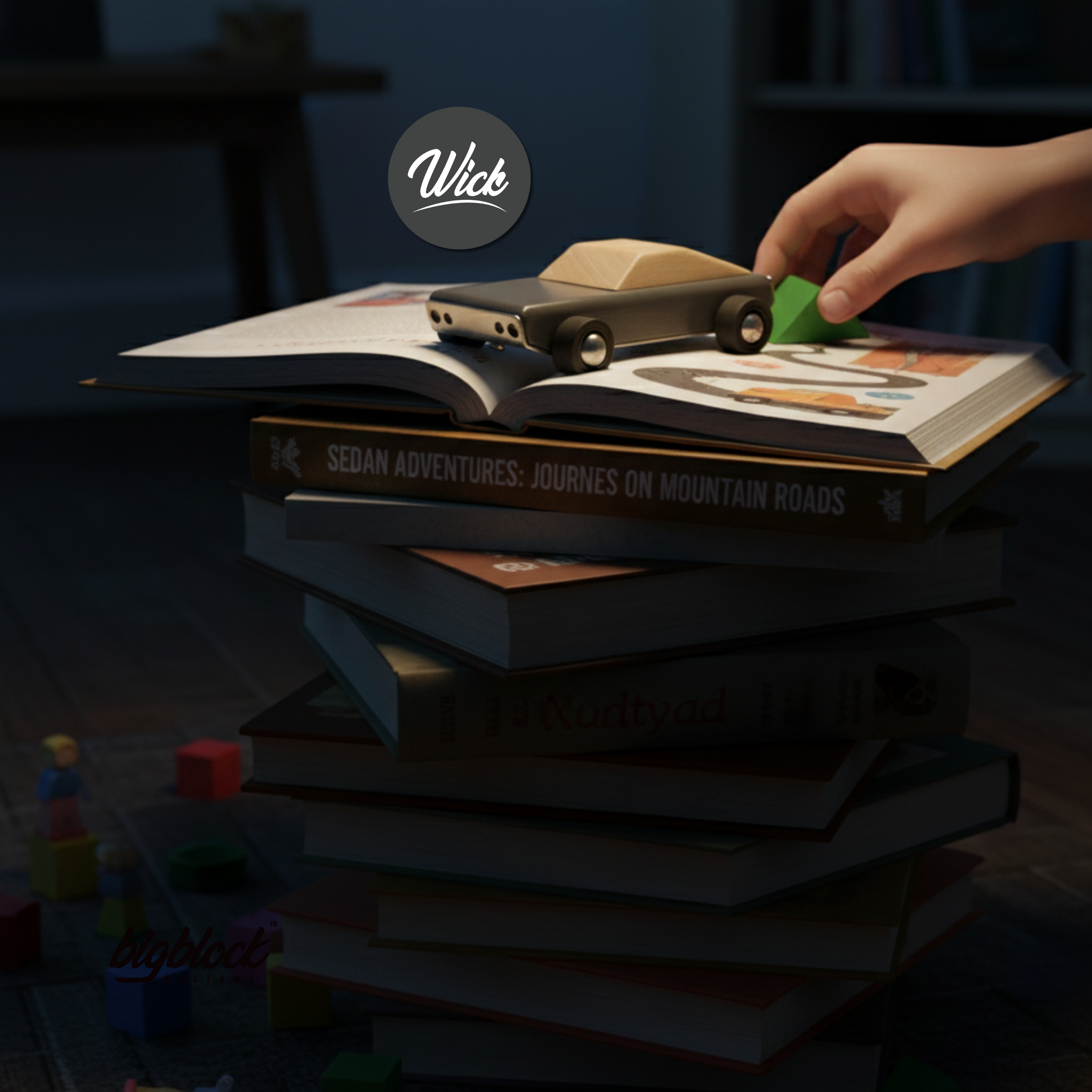 Stack of books with a wooden toy car on top, hand reaching for it, 'Wick' brand visible.