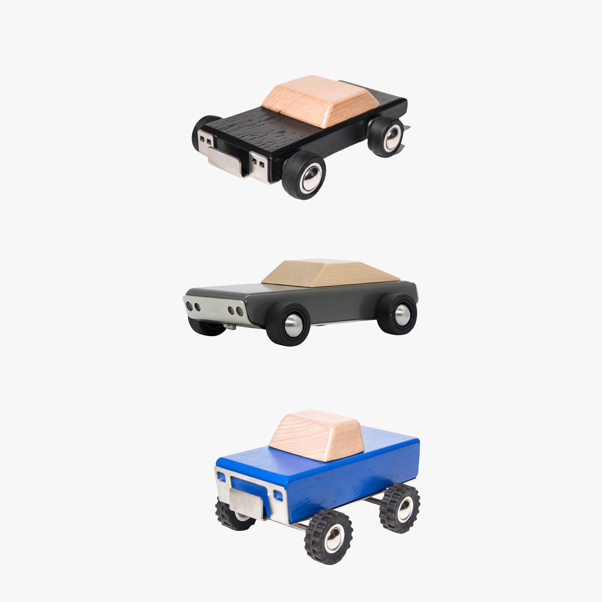 Three toy wooden cars with different colored bodies on a white background