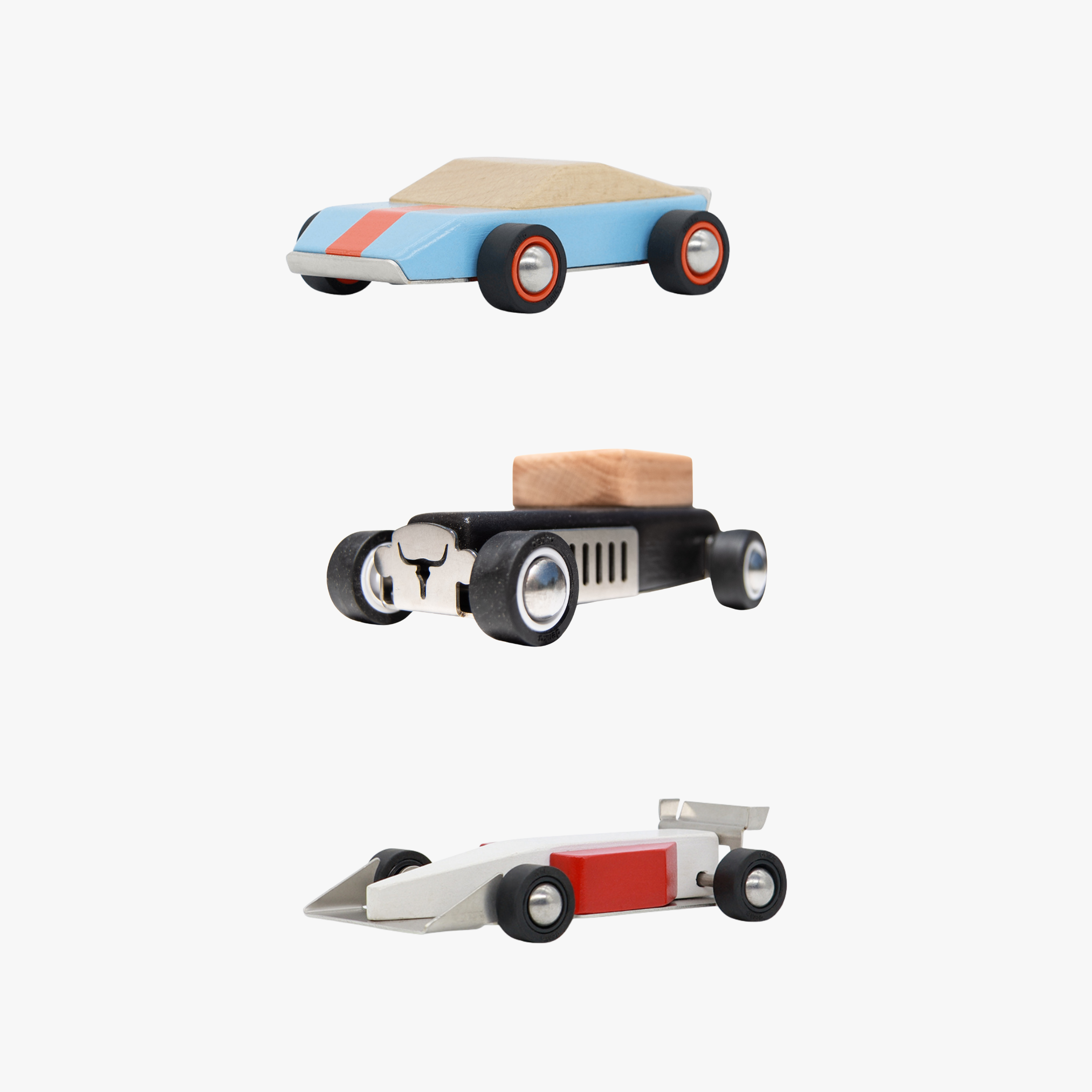 Three wooden toy cars on a white background