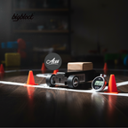 Wooden toy car with digital clock and traffic cones on a wooden surface, featuring 'bigblock' and 'Aces' logos.