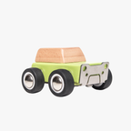 Small green toy truck with a brown bed on a white background