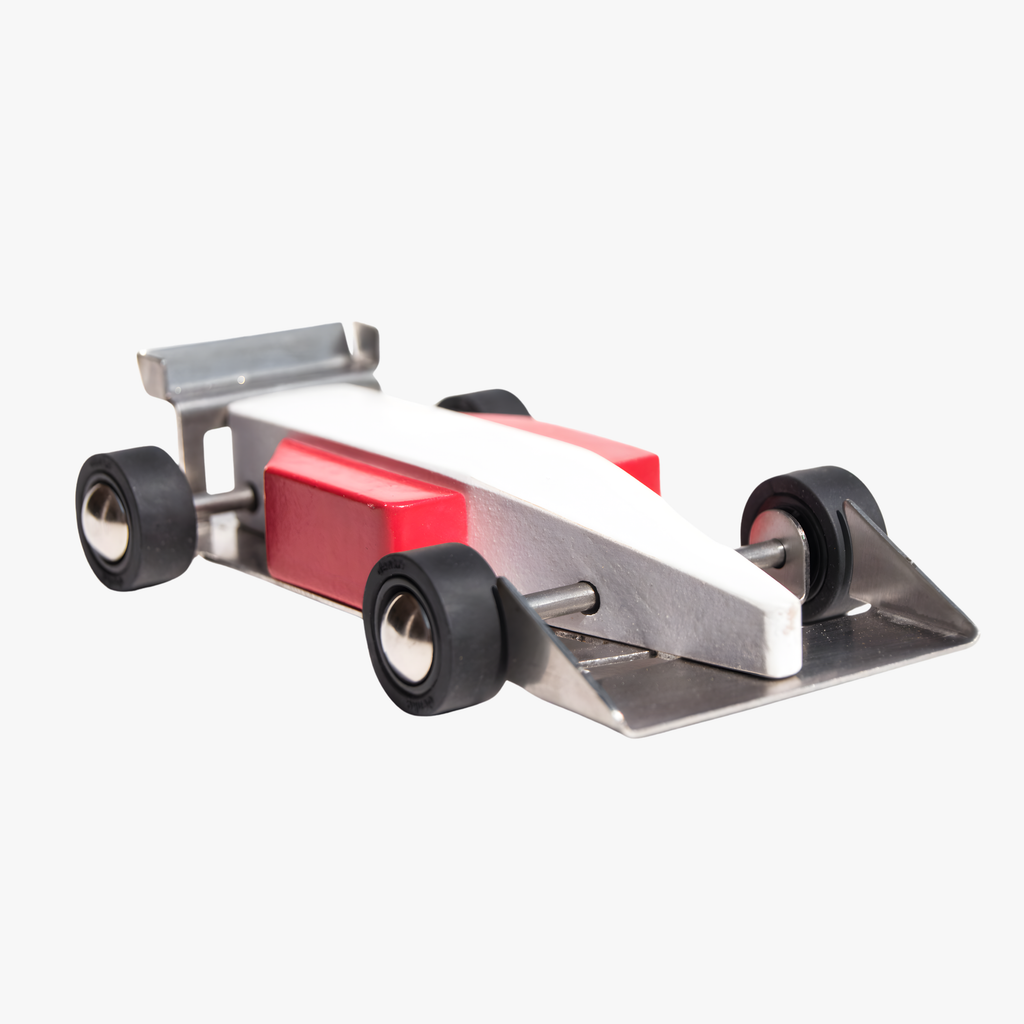 Wooden race car with red and white design on a white background