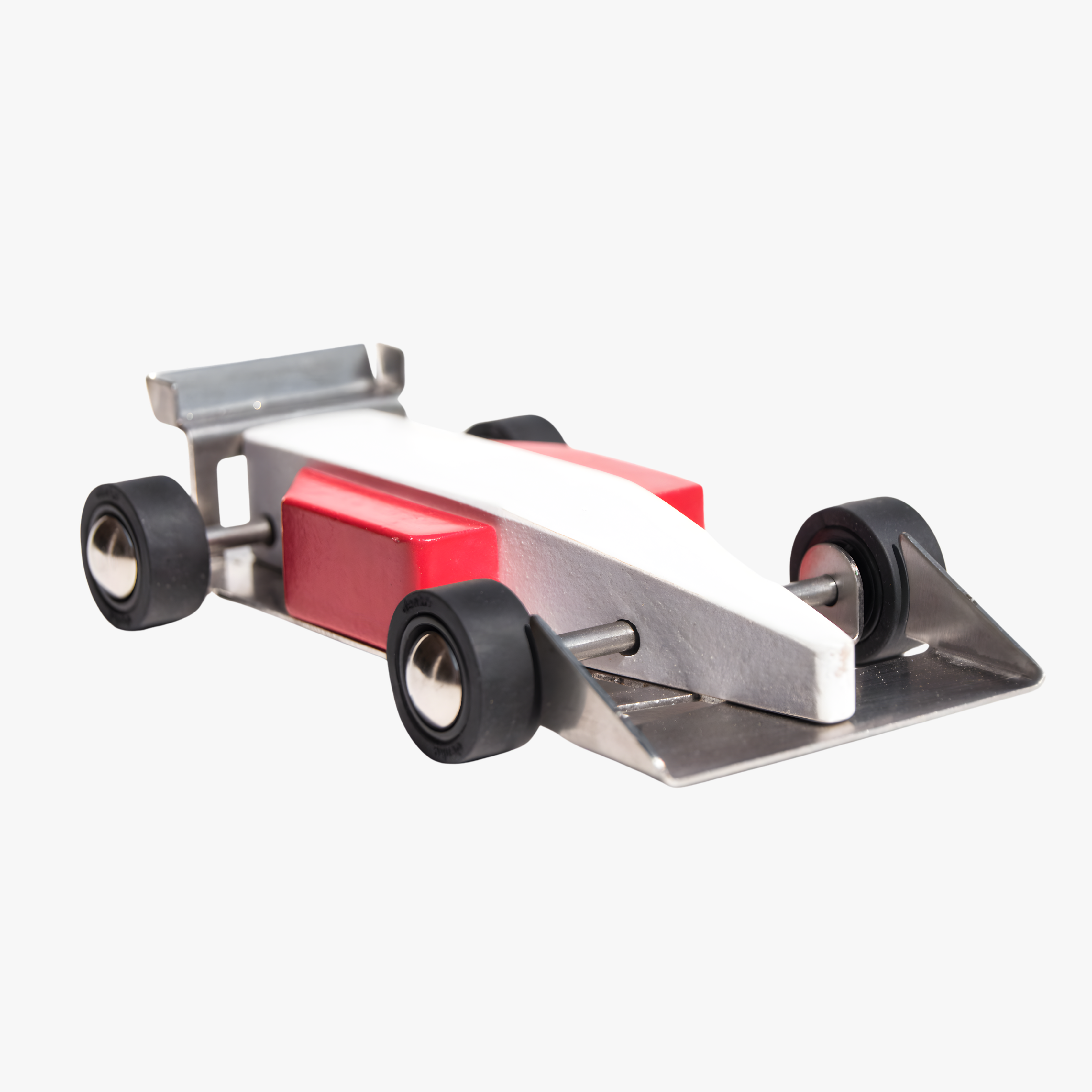Wooden race car with red and white design on a white background