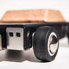 Close-up of a wooden toy car duke with a focus on the wheels.