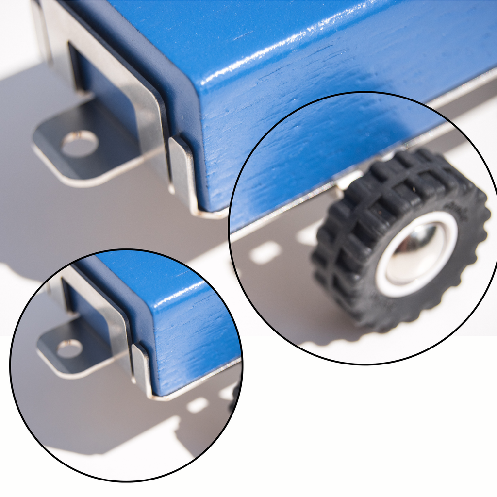 Close-up of a blue metal component with a black gear on a gray background