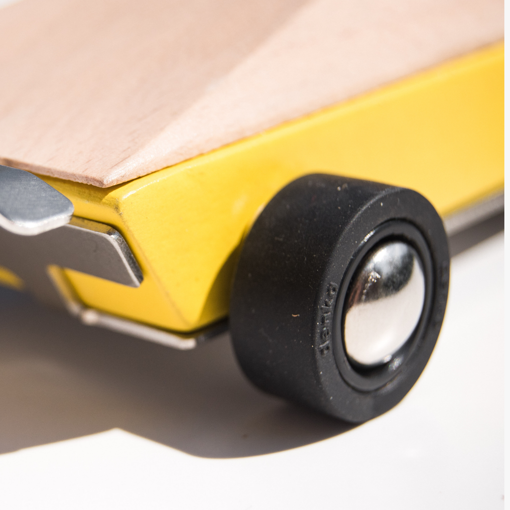 Close-up of a knife with a black handle and blade partially open.