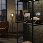 Modern interior with a shelf displaying a wooden toy car, framed picture, and books against a brick wall.