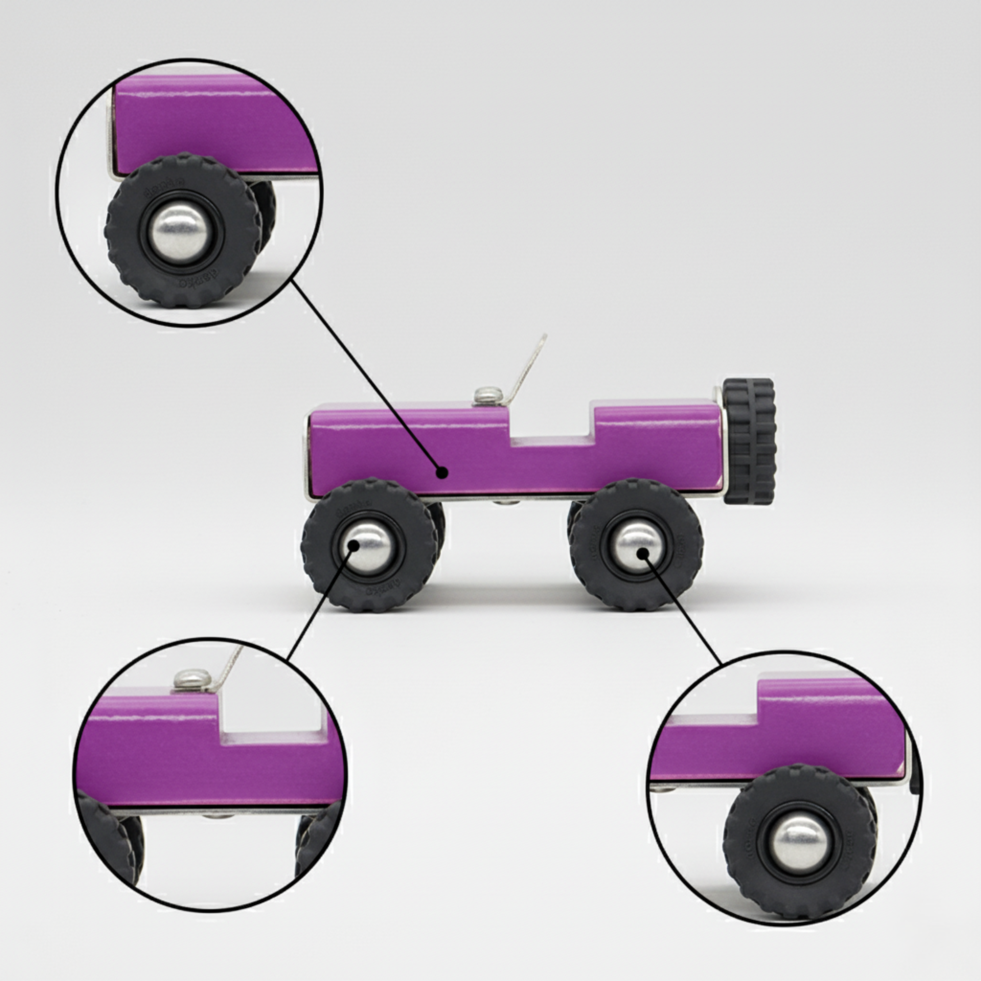 Purple wooden toy truck with close-up details on a gray background