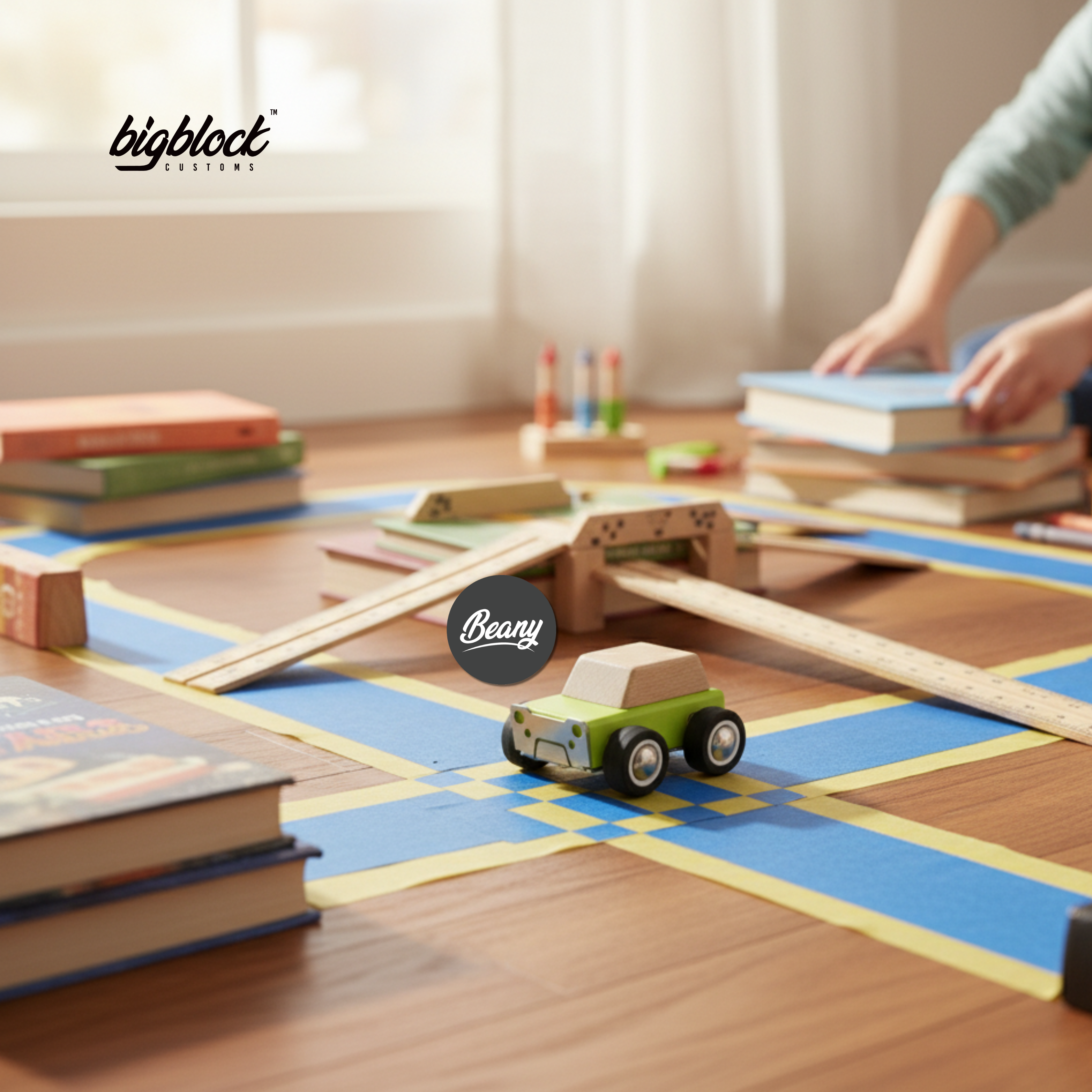 Wooden toy car on a wooden track with books and 'bigblock' branding in the background.