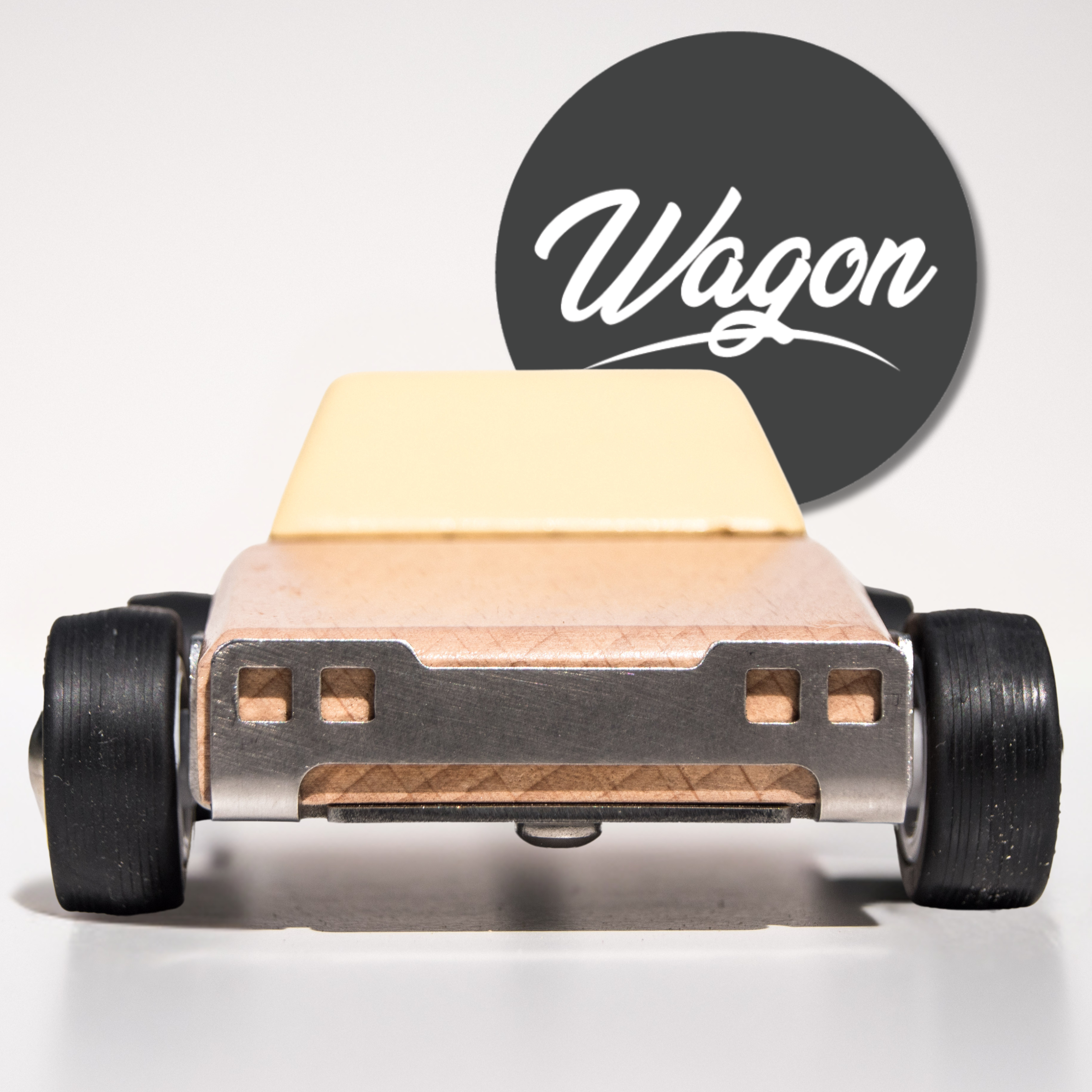 Model of a wooden toy car with 'Wagon' logo in the background