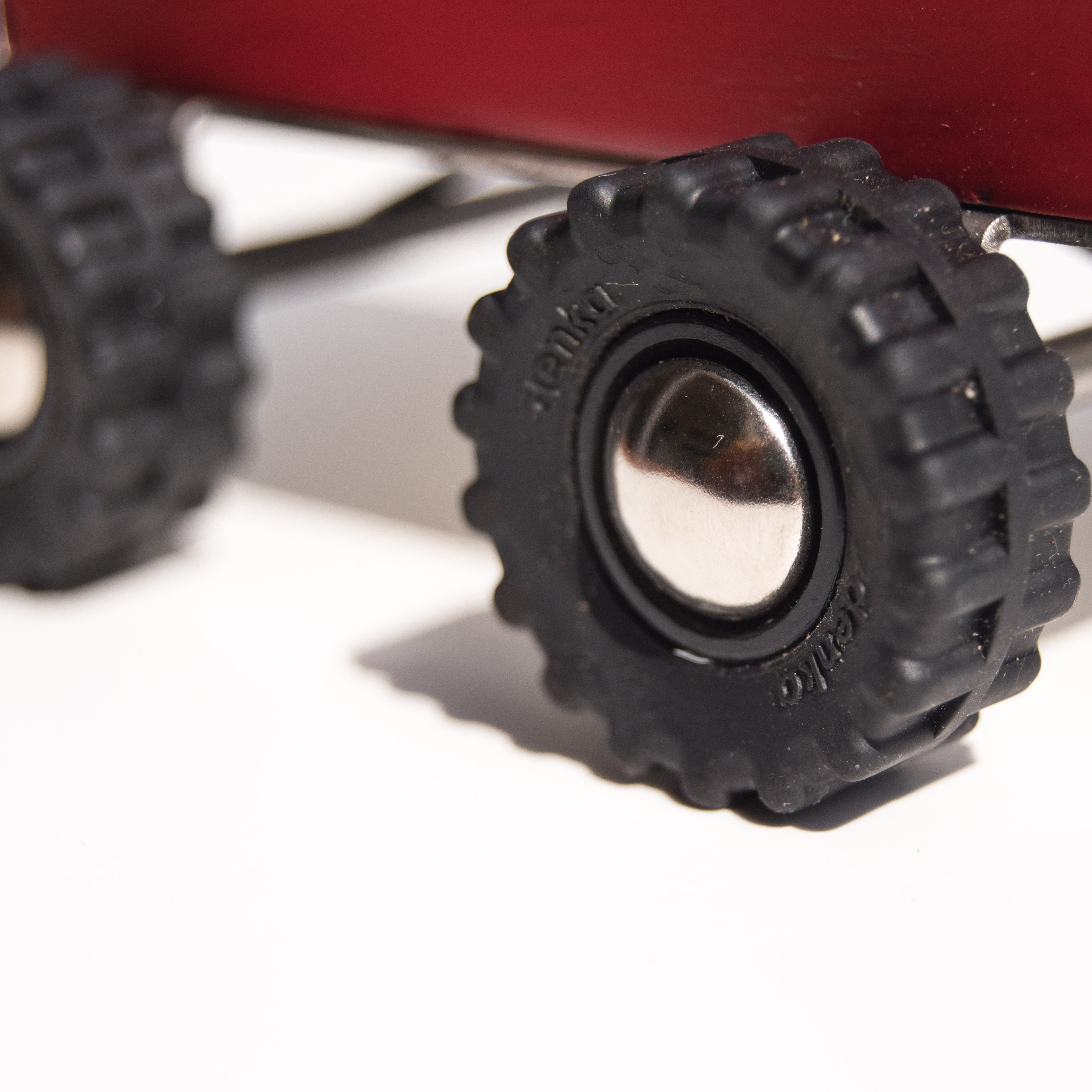 Close-up of a black gear on a white background