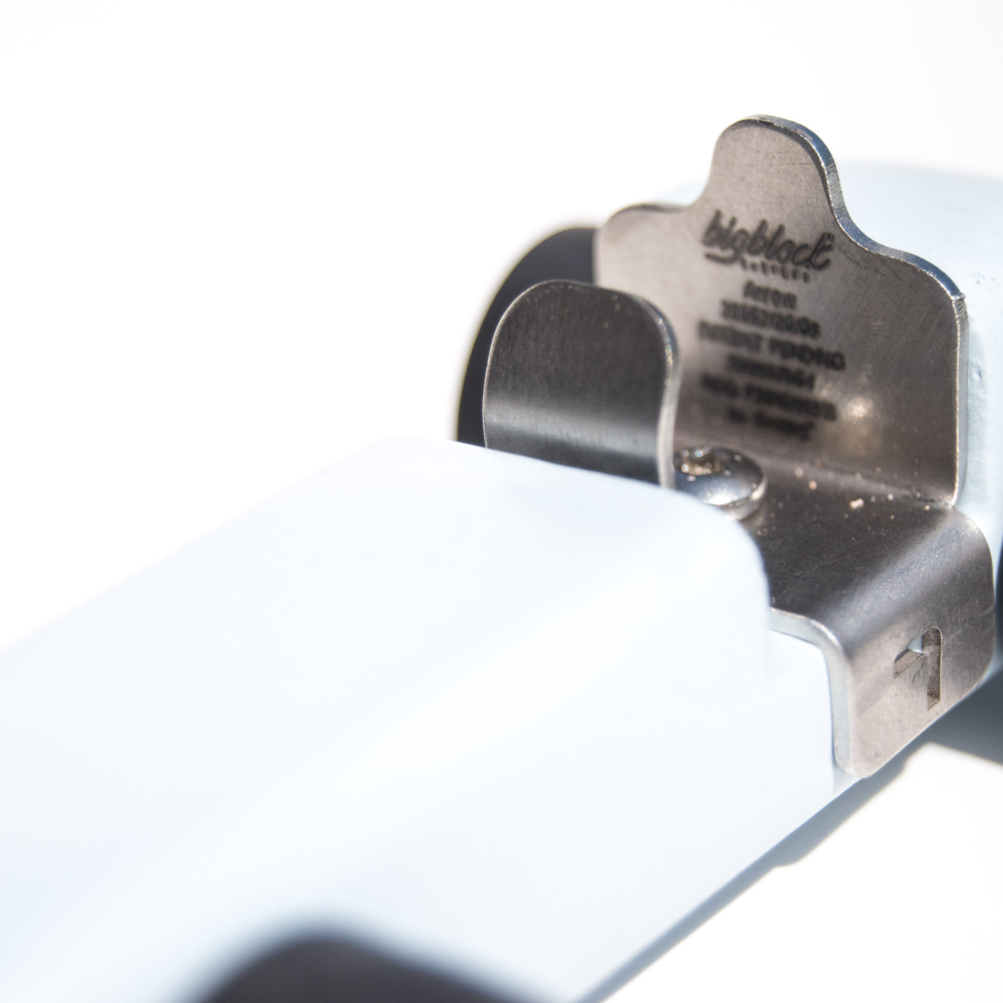 Metallic object with 'Big Block' branding on a white background