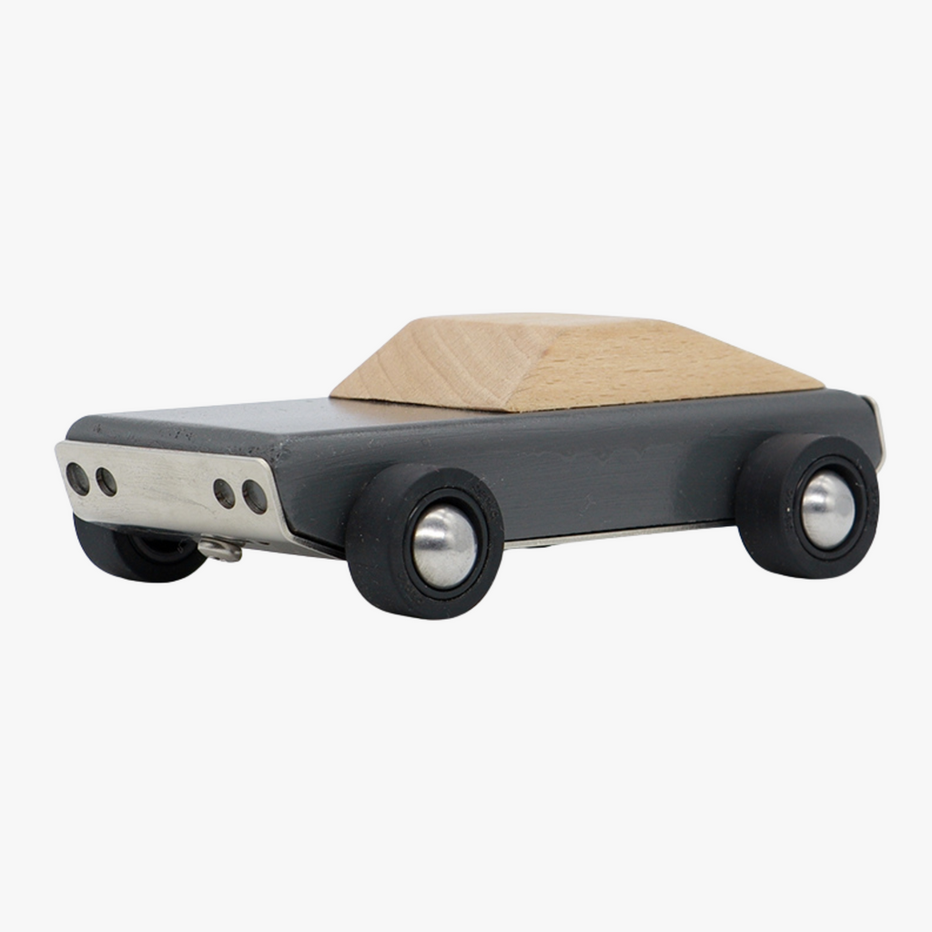 Wooden toy car with black body on a white background